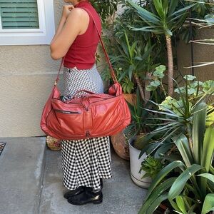 Vintage 90’s dusty orange convertible leather travel bag